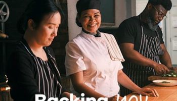 A picture of people in a retaurant preparing food